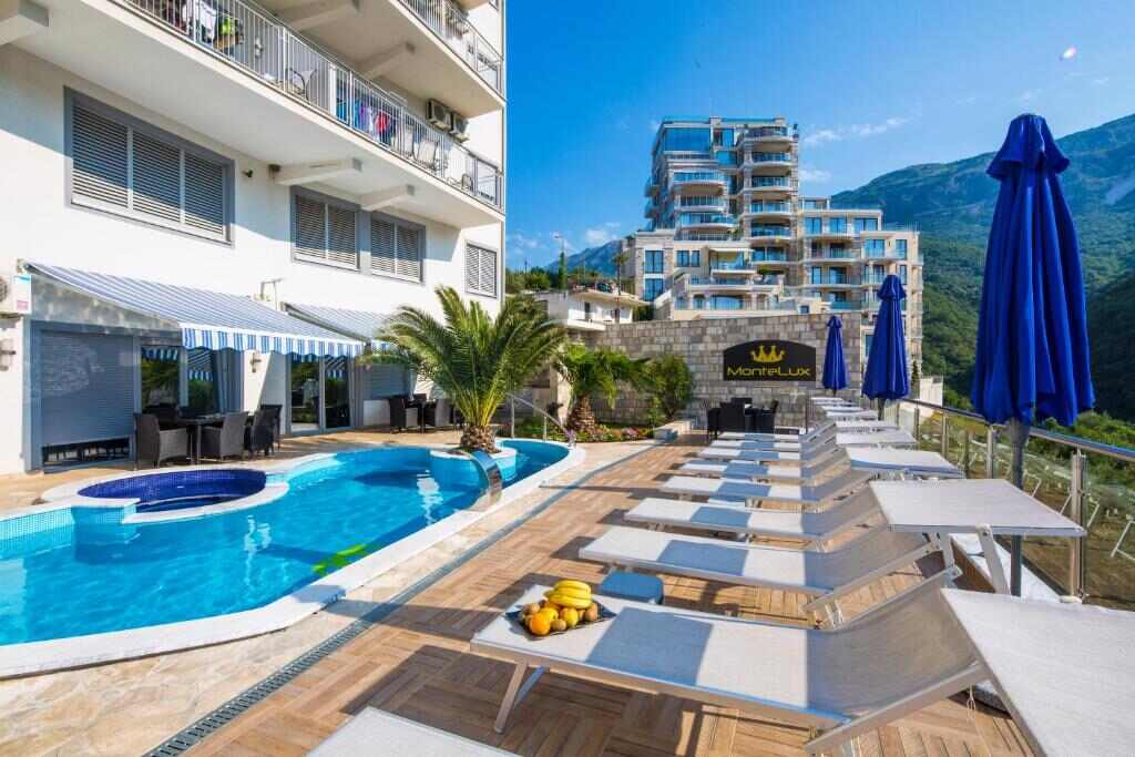 Pool, sun deck and mountain views at Montelux Apartments